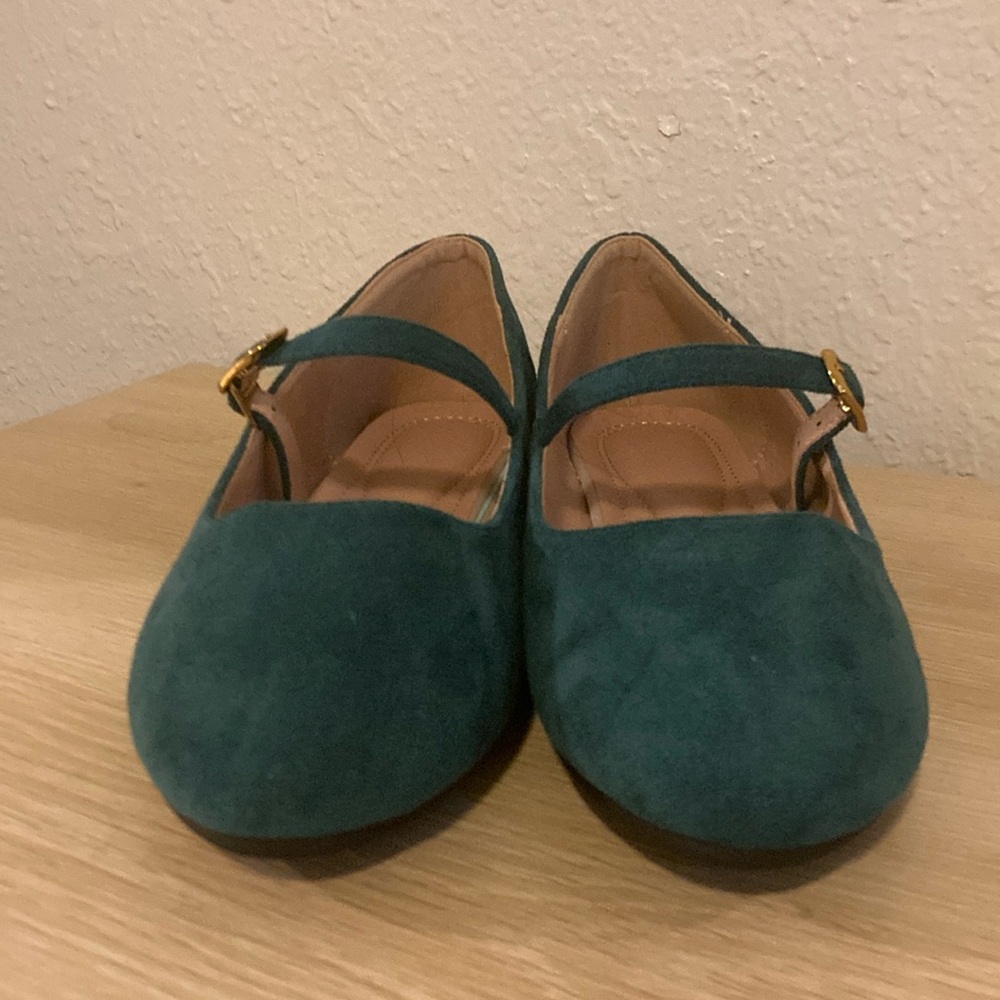 Suede green Mary Jane’s with gold embellishments.